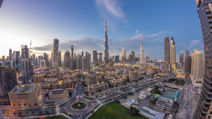 Fototapeta na wymiar Dubai Downtown skyline day to night timelapse with Burj Khalifa and other towers paniramic view from the top in Dubai