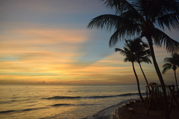 Fototapeta na wymiar Maceio - Alagoas - Brasil - March 22 2019 - beautiful sunset and coconut trees