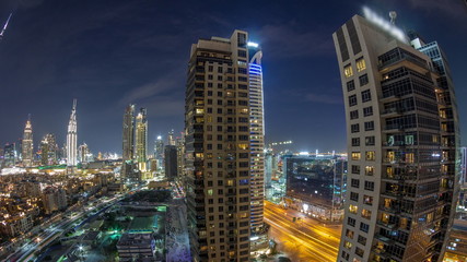 Obraz na płótnie Canvas Beautiful skyline of Dubai downtown and Business bay with modern architecture night timelapse.
