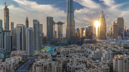 Dubai Downtown skyline during sunset timelapse with Burj Khalifa and other towers paniramic view from the top in Dubai