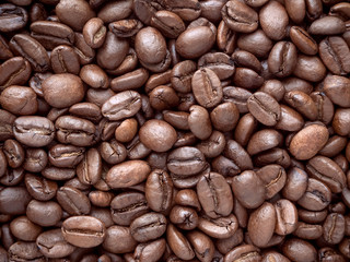 a lot of coffee beans medium roasted - food background