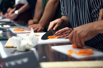 Obraz na płótnie Canvas fresh sushi preparation, smoked salmon