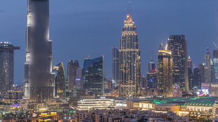 Fototapeta na wymiar Dubai Downtown skyline during sunset timelapse towers paniramic view from the top in Dubai
