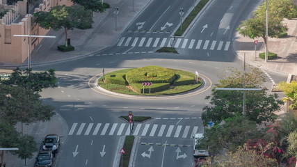 Aerial view of a roundabout circle road in Dubai downtown from above timelapse. Dubai, United Arab...