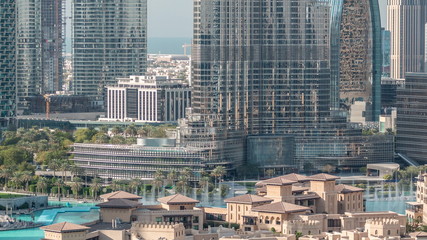 Famous musical fountain in Dubai with skyscrapers in the background aerial timelapse