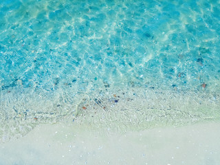 Fototapeta na wymiar Sea shore - a beach with white sand and stones