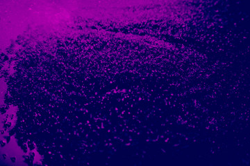 Beautiful pink and purple glitter texture on the black background and light glitter sparkle confetti gray pink grainy abstract texture on a black background and wallpaper