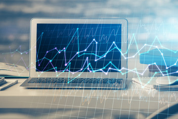 Multi exposure of chart and financial info and work space with computer background. Concept of...