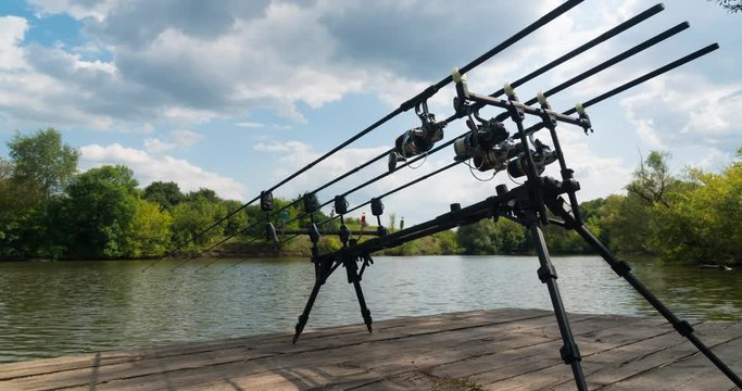 Timelapse, carp fishing, rodpod, fishing rods, reels on a wooden platform