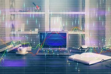 Double exposure of chart and financial info and work space with computer background. Concept of international online trading.