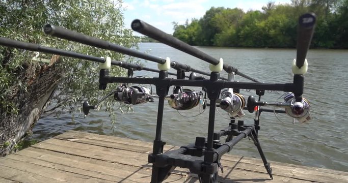 Carp fishing, rodpod on a wooden platform on a pond