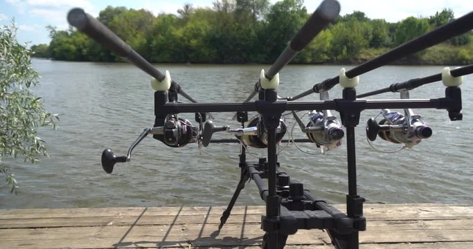 Carp fishing, rodpod on a wooden platform on a pond