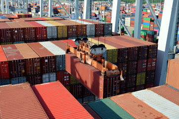 Cargo container ship loading containers in the port of Savannah, Georgia.