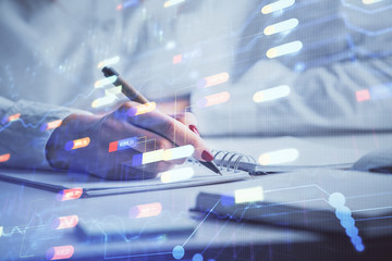 Multi exposure of writing hand on background with data technology hologram. Concept of innovation.