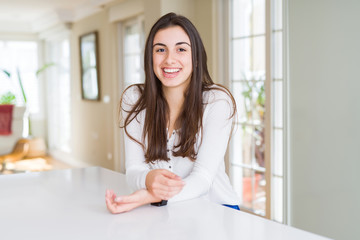 Beautiful young brunette woman smiling cheerful looking at the camera with a big smile on face...