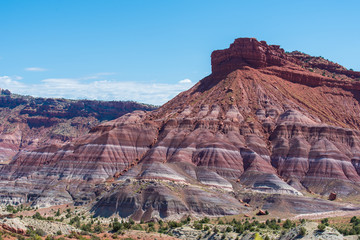 Landscape of purple, red, pink and white striped or banded hills at Paria Canyon in Grand Staircase Escalante National Monument