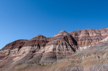 Fototapeta na wymiar Landscape of striped hillsides at Paria Canyon in Grand Staircase Escalante National Monument