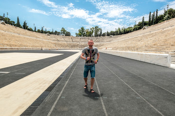  Athlete running on the track at the Panathenaic stadium.