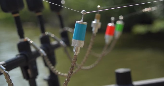 Slow motion, carp fishing, bite swinger signaling device