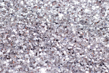 Silver glitter texture. Festive sparkling sequins background. Wpaper for Valentine, New Year or Christmas Holidays