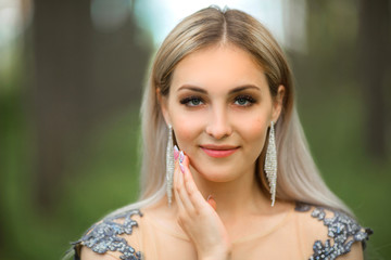 portrait of a beautiful young woman with makeup and hairstyle