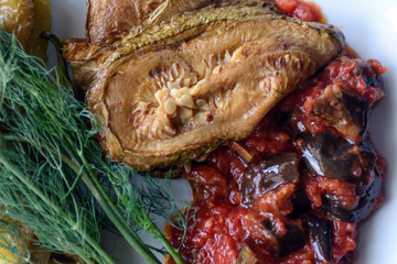 On a white plate and vegetable salad. The concept is a vegetable diet. Vegan