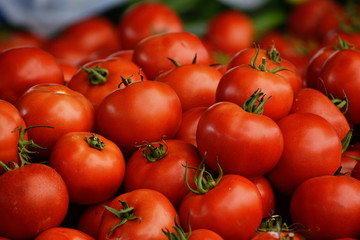 Ripe tomatoes in natural light on the counter. The concept is an oriental bazaar. Healthy eating