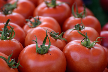 Ripe tomatoes in natural light on the counter. The concept is an oriental bazaar. Healthy eating