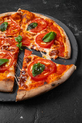 salami pizza. pepperoni pizza on black background