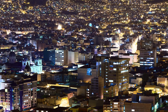 View over the city center of La Paz, Bolivia at night. On the left side the Metropolitan Cathedral on Murillo Square can be seen.