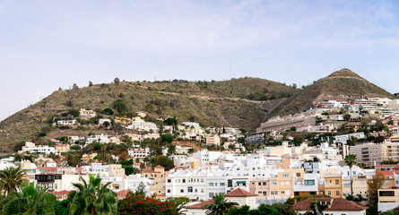 Fototapeta na wymiar Residential houses on a slope of the mountain in Santa Cruz de Tenerife, Canary Islands, Spain