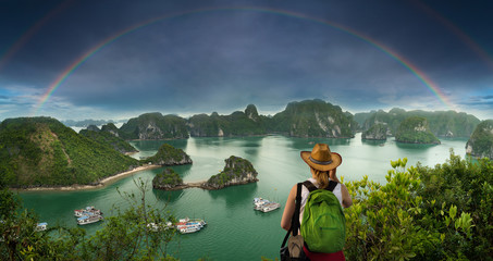 Young tourist girl watching the Halong Bay, travel and vacation concept ( Vietnam ) 