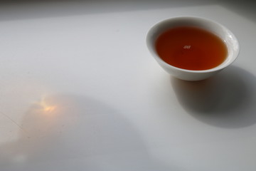 Chinese tea ceremony using tea utensils made of glass and porcelain.