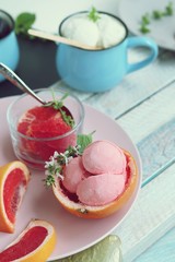  Natural ice cream, grapefruit, basil on a wooden table, tasty and healthy dessert, seasonal food