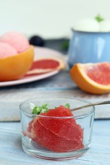  Natural ice cream, grapefruit, basil on a wooden table, tasty and healthy dessert, seasonal food