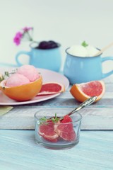  Natural ice cream, grapefruit, basil on a wooden table, tasty and healthy dessert, seasonal food