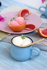  Natural ice cream, grapefruit, basil on a wooden table, tasty and healthy dessert, seasonal food