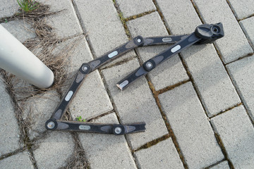 Cut bicycle lock by thieves with bolt cutter after stealing a bike near the parking lot, details,...