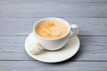 Cup of coffee with candy