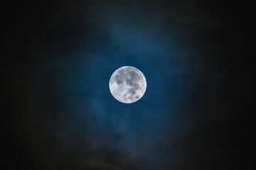 Full moon on the dark blue sky