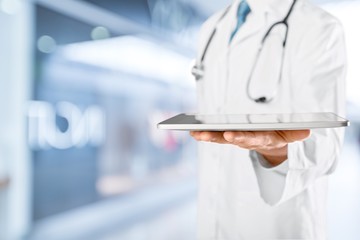 Close-up Doctor at hospital working with tablet pc