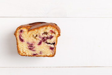 Homemade berry cake on white wooden background