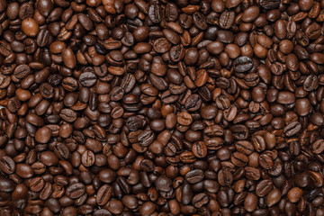 Fototapeta premium top view of tasty fresh textured coffee grains