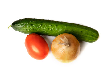Vegetables, an onion, tomato and cucumber isolated on white background. The concept of agriculture, healthy lifestyle, healthy eating and diet.