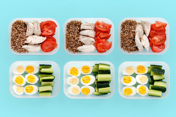 Chicken breast and vegetables in containers. Flat lay