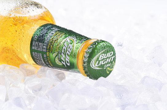IRVINE, CA - APRIL 10, 2017: Bud Light Lime Bottle on Ice. From Anheuser-Busch InBev, Bud Light Lime is a flavored beer introduced in 2008.
