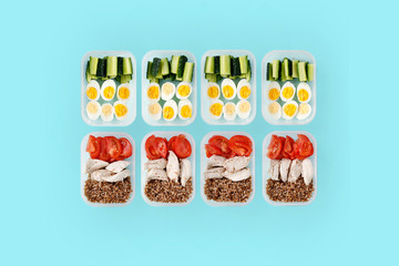 Chicken breast and vegetables in containers. Flat lay