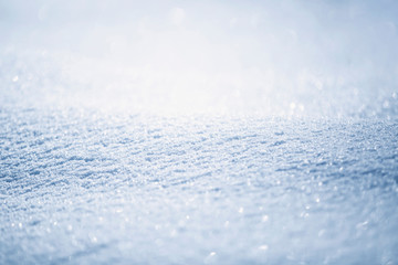 Artistic blurry snow texture christmas background. Copy space background.