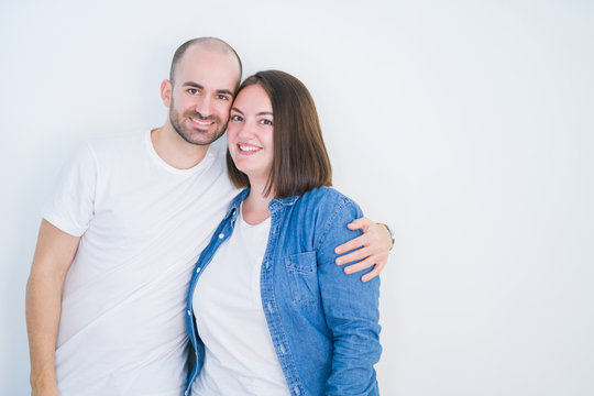 Young couple together over white isolated background with a happy and cool smile on face. Lucky person.