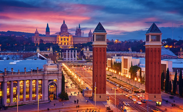 Fototapeta Barcelona, Spain. Nighttime top view at Spanish Square with tower and national palace art museum Catalonia far away.